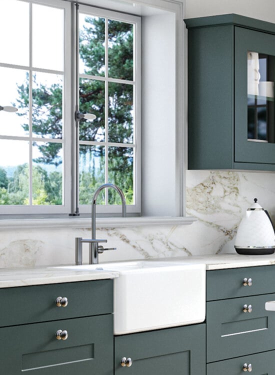 a deep green kitchen featuring the Carrick style cabinet doors
