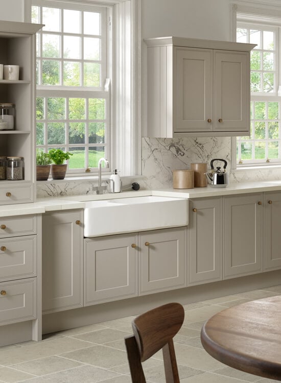 a traditional oatmeal beige kitchen featuring the Tullymore style cabinet doors