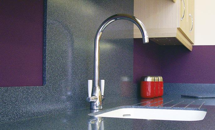 Kitchen tap, sink and worktops